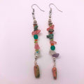 Long linear mixed crystal chip earrings with wire-wrapped unakite pendant on white background