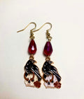 Black enamel raven perched on white skull with red roses drop earrings with dark red Czech glass teardrop beads and 14k gold plated hooks