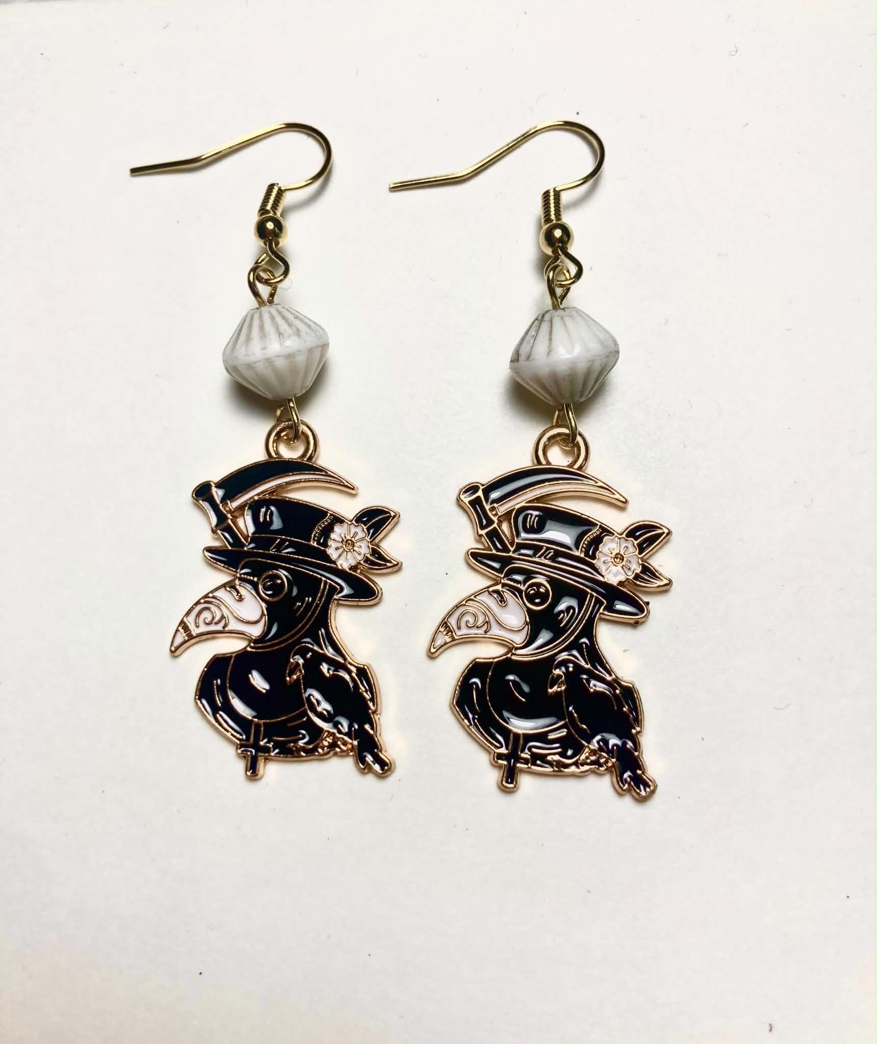 Black gold enamel plague doctor with scythe drop earrings with vintage white ceramic beads and 14k gold plated hooks