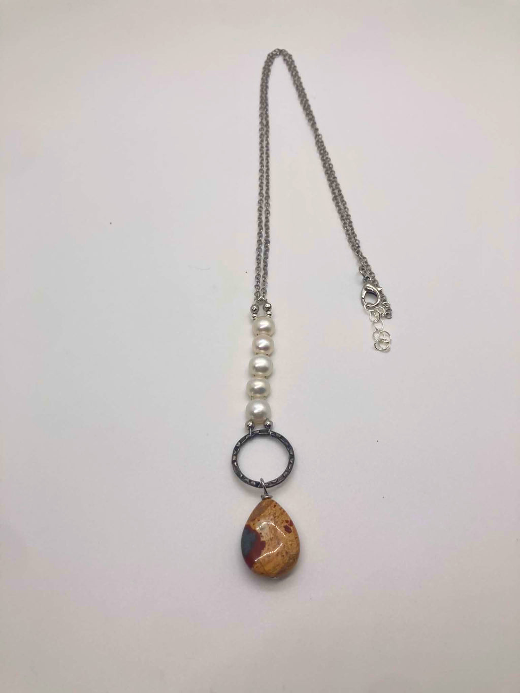 Freshwater pearl necklace with Brecciated Jasper teardrop pendant on a silver chain
