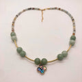 Green aventurine and matte glass bead necklace with gold tube accents and abalone clover pendant