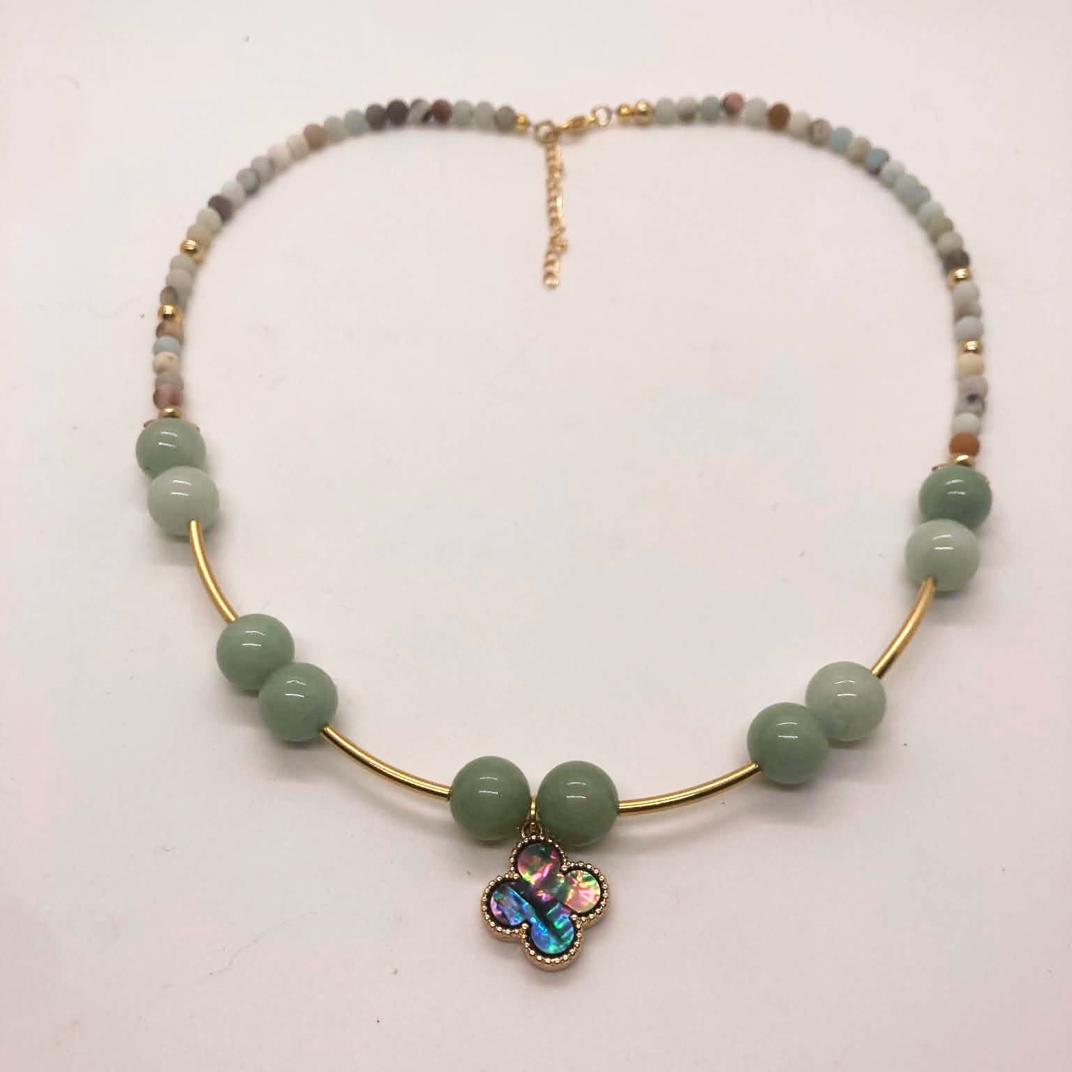 Green aventurine and matte glass bead necklace with gold tube accents and abalone clover pendant