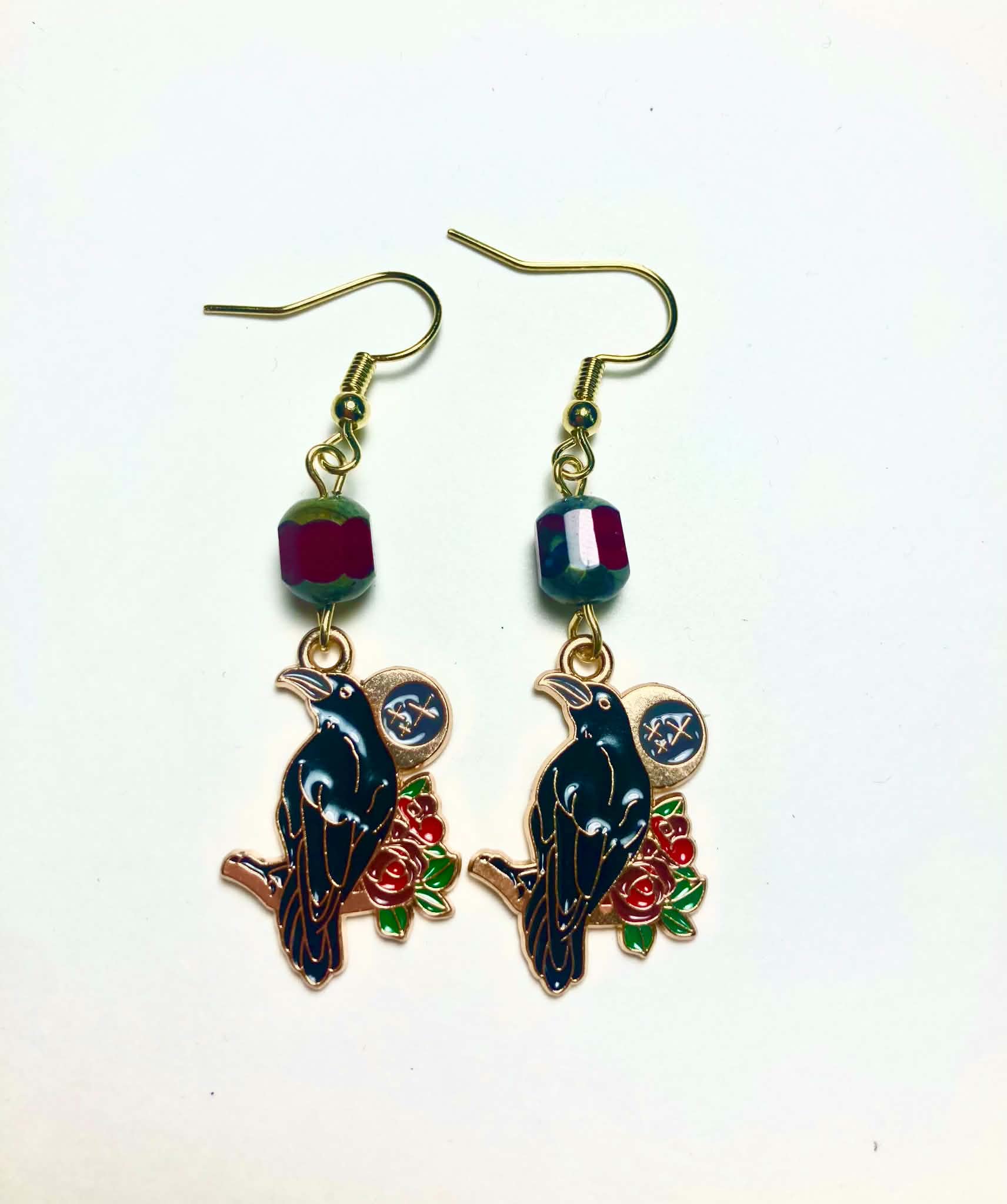 Dark teal and black enamel raven with red roses and moon medallion drop earrings with dark red Czech glass beads and 14k gold plated hooks