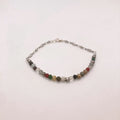 Dainty figaro chain bracelet with garnet, jade, coral, jasper and mookaite beads and a silver star charm centerpiece