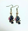 Black raven and rose gold enamel drop earrings with faceted peach Czech glass beads and 14k gold plated hooks