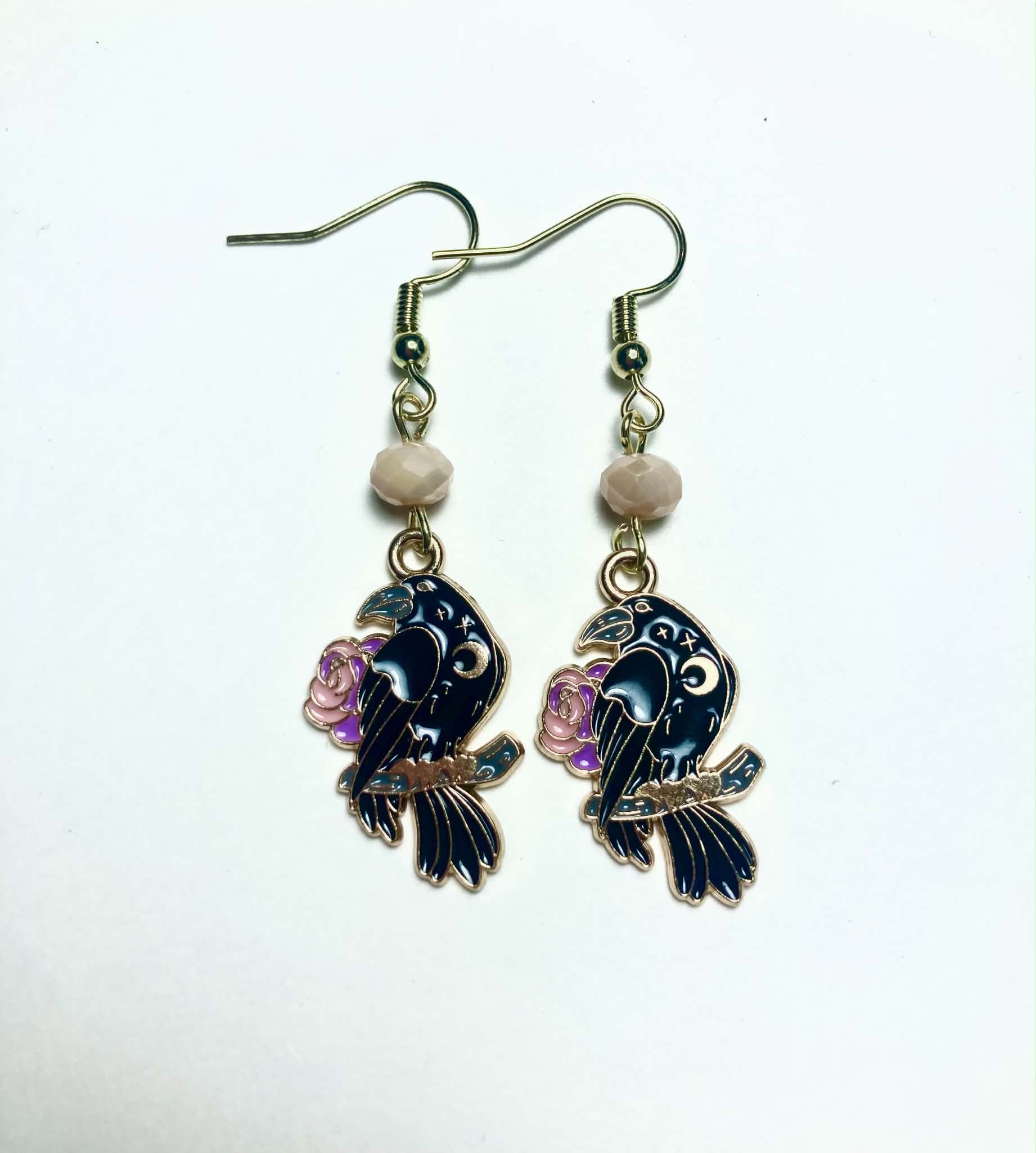 Black raven and rose gold enamel drop earrings with faceted peach Czech glass beads and 14k gold plated hooks