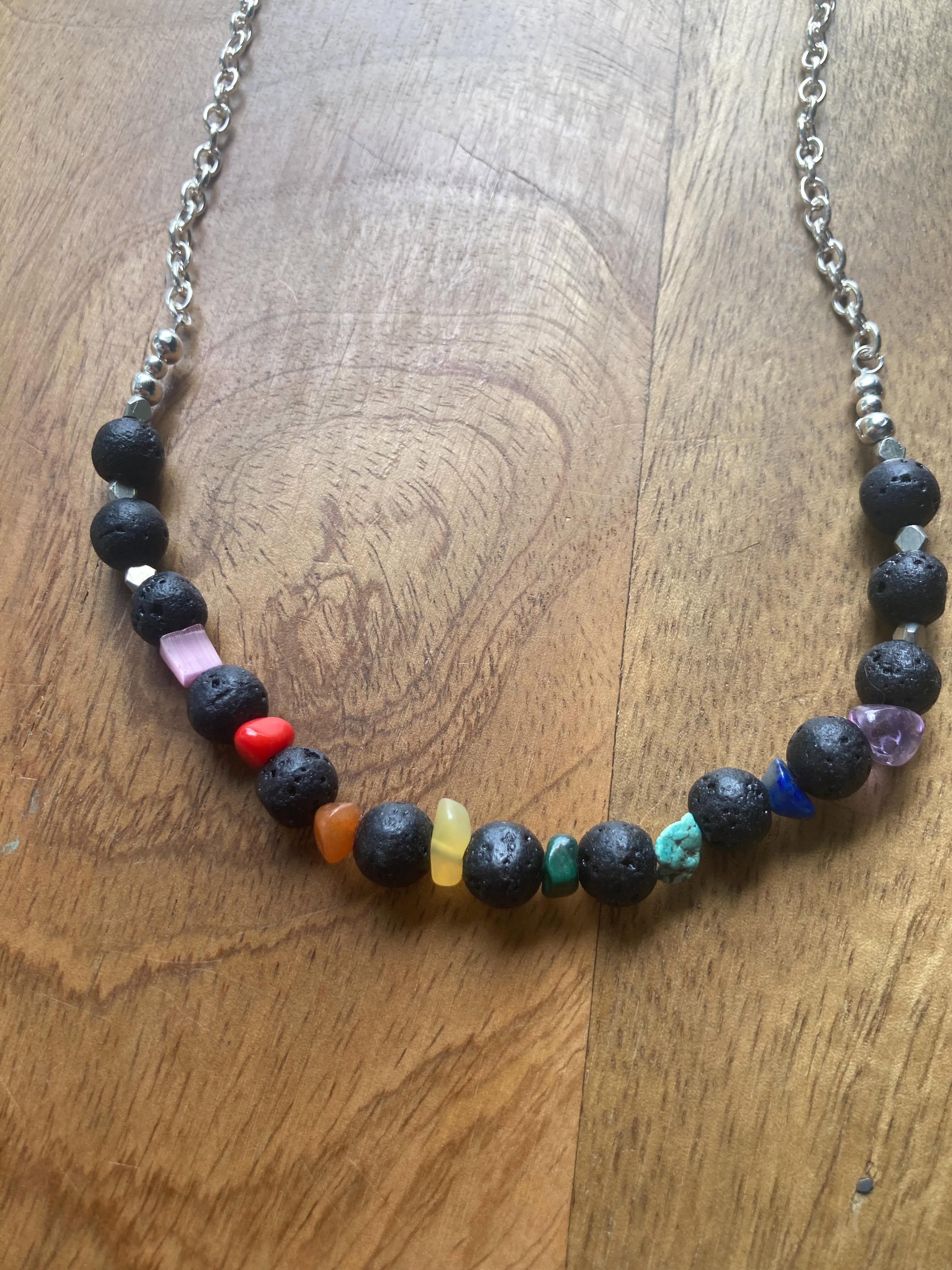 Necklace with multicolored beads on a wooden surface
