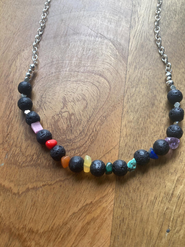 Necklace with multicolored beads on a wooden surface