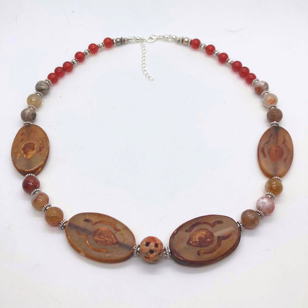 Ancient Earth Statement Necklace featuring petrified wood slabs, soapstone center bead, red carnelian rounds, and silver spacers