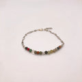 Dainty mixed gemstone bracelet with clear quartz, Picasso jasper, mookaite, moonstone and Venus jasper beads on silver figaro chain